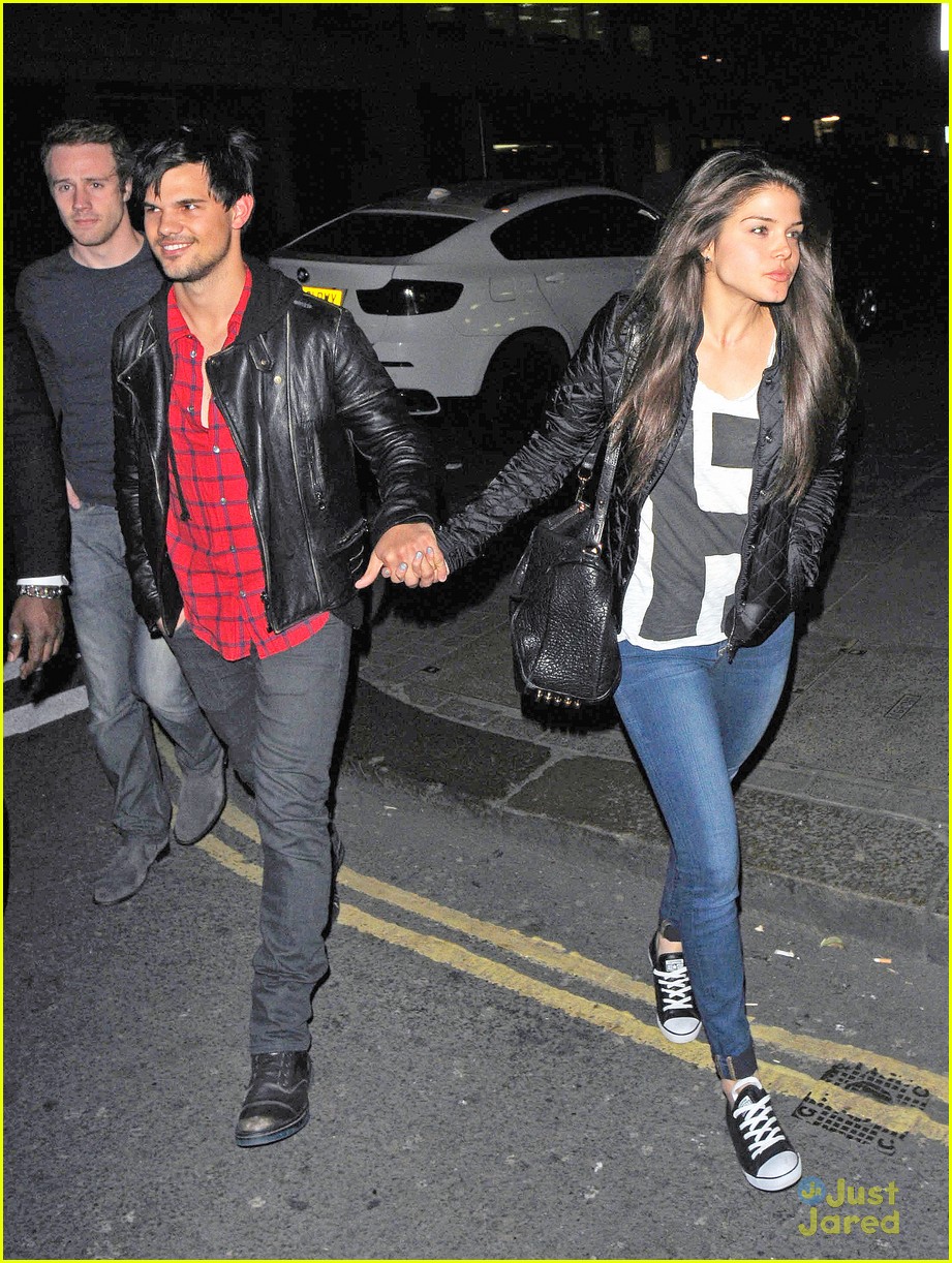 taylor lautner marie avgeropoulos matching jackets london 11